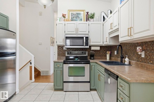 10703 31 Street, Edmonton, AB - Indoor Photo Showing Kitchen With Double Sink