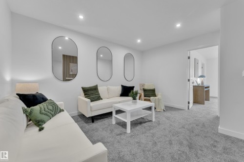 Living room with recessed lighting and light carpet - 70 Silverstone Drive, Stony Plain, AB - Indoor