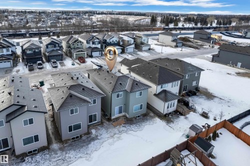 Snowy aerial view featuring a residential view - 70 Silverstone Drive, Stony Plain, AB - Outdoor
