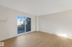 Unfurnished room with wood finished floors and baseboards - 