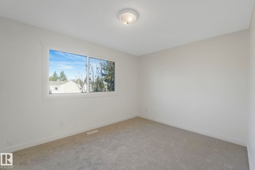 Spare room featuring carpet and baseboards - 5833 Riverbend Road, Edmonton, AB - Indoor Photo Showing Other Room