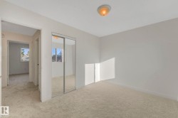 Unfurnished bedroom with carpet flooring and a closet - 
