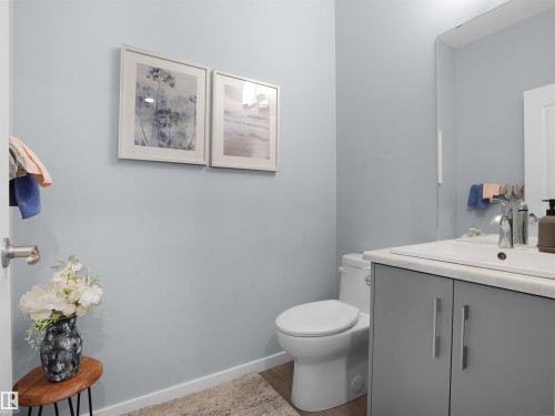 Half bathroom with vanity and wood finished floors - 207 41 Avenue, Edmonton, AB - Indoor Photo Showing Bathroom