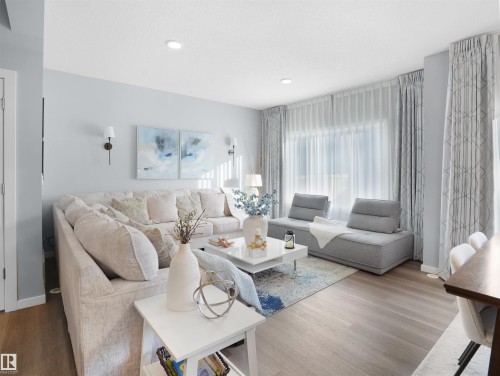 Living area featuring wood finished floors and recessed lighting - 207 41 Avenue, Edmonton, AB - Indoor Photo Showing Living Room