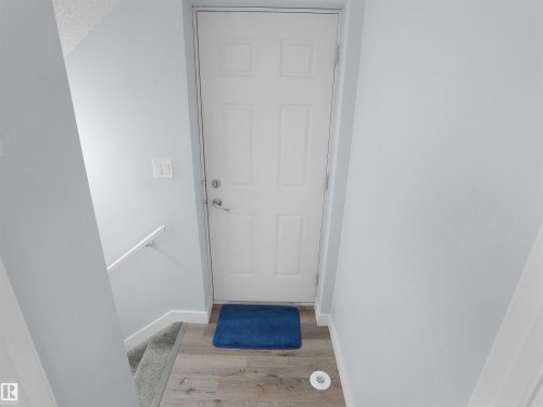 Doorway with wood finished floors and baseboards - 207 41 Avenue, Edmonton, AB - Indoor Photo Showing Other Room