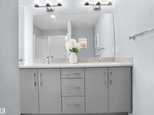 Bathroom with double vanity and a stall shower - 207 41 Avenue, Edmonton, AB - Indoor Photo Showing Bathroom