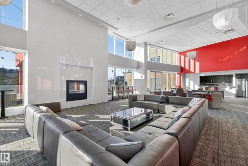 201 5151 Windermere Boulevard, Edmonton, AB - Indoor Photo Showing Living Room With Fireplace