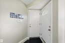 Doorway to outside with a textured ceiling and tile patterned floors - 2952 39 Avenue, Edmonton, AB  - Indoor Photo Showing Other Room 