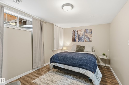 Bedroom with wood finished floors and baseboards - 2952 39 Avenue, Edmonton, AB - Indoor Photo Showing Bedroom