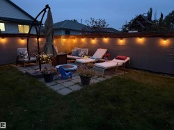View of patio featuring an outdoor living space with a fire pit - 