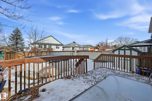 Snow covered deck featuring a residential view and a storage shed - 2952 39 Avenue, Edmonton, AB - Outdoor