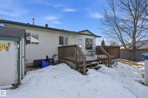 Snow covered back of property with a wooden deck - 2952 39 Avenue, Edmonton, AB - Outdoor With Exterior