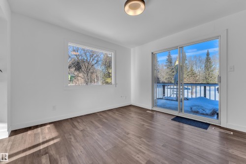 Unfurnished room featuring wood finished floors and plenty of natural light - 20920 9 Avenue, Edmonton, AB - Indoor Photo Showing Other Room