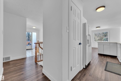 Corridor featuring dark wood-style floors and an upstairs landing - 20920 9 Avenue, Edmonton, AB - Indoor Photo Showing Other Room