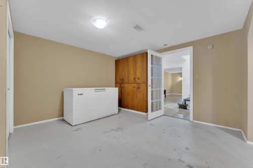 Laundry area with concrete flooring and baseboards - 20920 9 Avenue, Edmonton, AB - Indoor Photo Showing Laundry Room