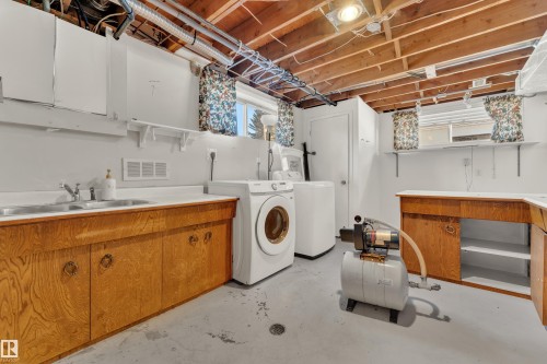 Laundry area with concrete floors and washer and dryer - 20920 9 Avenue, Edmonton, AB - Indoor Photo Showing Laundry Room