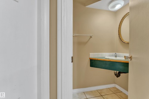 Bathroom featuring tile patterned floors and baseboards - 20920 9 Avenue, Edmonton, AB - Indoor