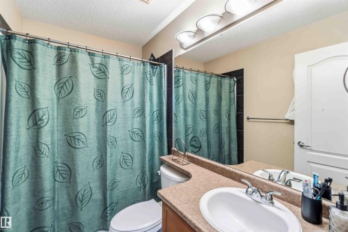 Full bath featuring a textured ceiling and vanity - 11715 167A Avenue, Edmonton, AB - Indoor Photo Showing Bathroom