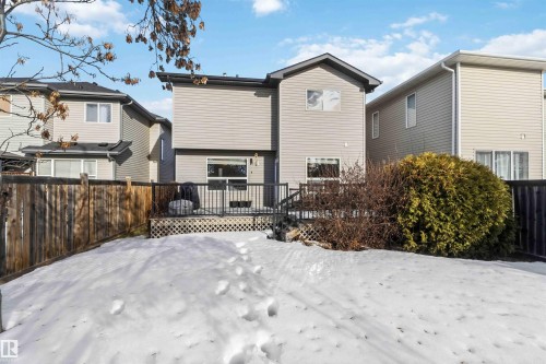 Rear view of property featuring a wooden deck and a fenced backyard - 11715 167A Avenue, Edmonton, AB - Outdoor With Exterior