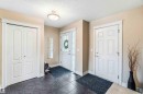 Foyer featuring a textured ceiling and dark tile patterned floors - 11715 167A Avenue, Edmonton, AB  - Indoor Photo Showing Other Room 