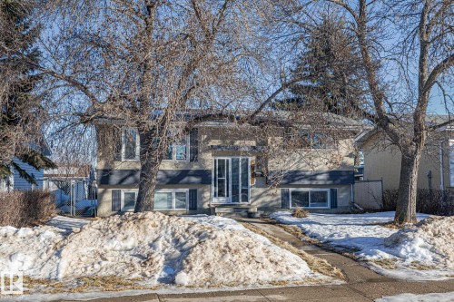 Raised ranch featuring stucco siding and a gate - 14911 96 Street, Edmonton, AB - Outdoor