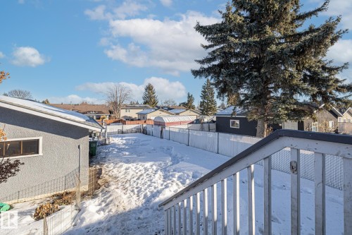 Snowy yard with a residential view and a fenced backyard - 14911 96 Street, Edmonton, AB - Outdoor