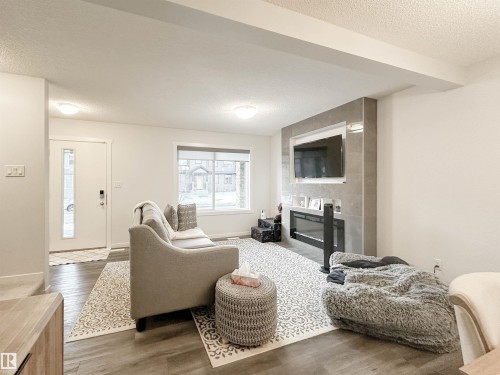 1270 Rosenthal Boulevard, Edmonton, AB - Indoor Photo Showing Living Room With Fireplace