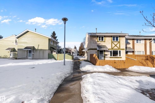Snow covered property with a residential view - 15C Callingwood Crest, Edmonton, AB - Outdoor