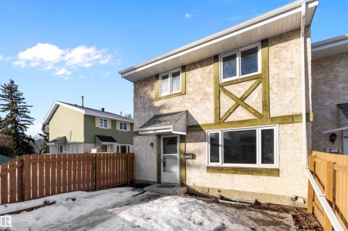 Back of property featuring stucco siding - 15C Callingwood Crest, Edmonton, AB - Outdoor With Exterior