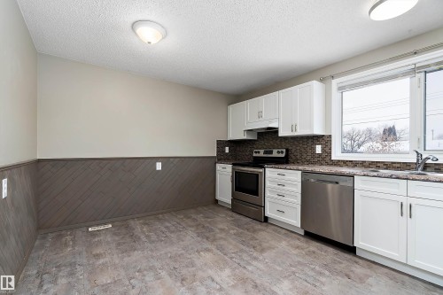 10 Wild Hay Drive, Devon, AB - Indoor Photo Showing Kitchen With Stainless Steel Kitchen