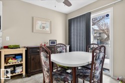Dining area featuring ceiling fan and a textured ceiling - 