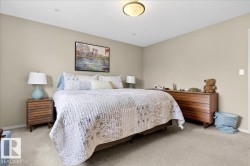 Carpeted bedroom with baseboards and a textured ceiling - 