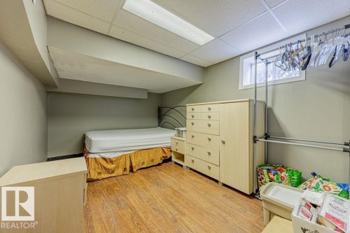 Bedroom with a paneled ceiling and light wood-style flooring - 12253 95A Street, Edmonton, AB - Indoor Photo Showing Other Room