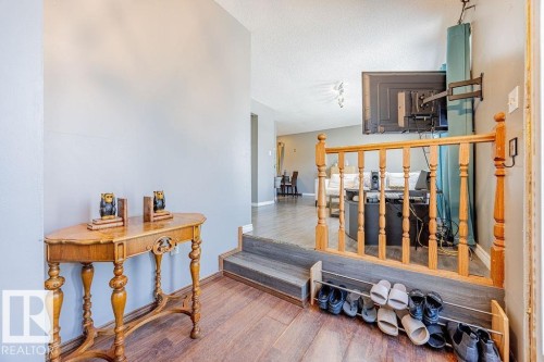 Corridor with wood finished floors and a textured ceiling - 12253 95A Street, Edmonton, AB - Indoor Photo Showing Other Room