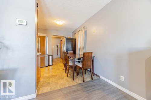 Dining space featuring a textured ceiling and baseboards - 12253 95A Street, Edmonton, AB - Indoor