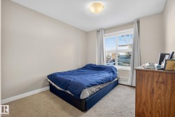 Carpeted bedroom with baseboards - 