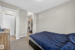 Bedroom with light carpet and baseboards - 