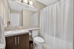 Bathroom featuring vanity, tile patterned flooring, and shower / bath combo - 