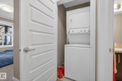 Laundry area featuring stacked washer / drying machine - 