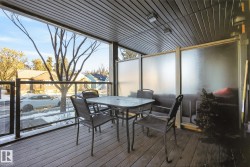 Sunroom featuring outdoor dining space and a deck - 