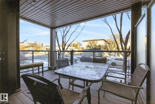 Deck featuring outdoor dining area and a residential view - 104 8515 99 Street, Edmonton, AB - Outdoor With Deck Patio Veranda With Exterior