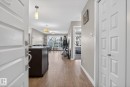Corridor featuring light wood-style floors and baseboards - 104 8515 99 Street, Edmonton, AB  - Indoor Photo Showing Other Room 