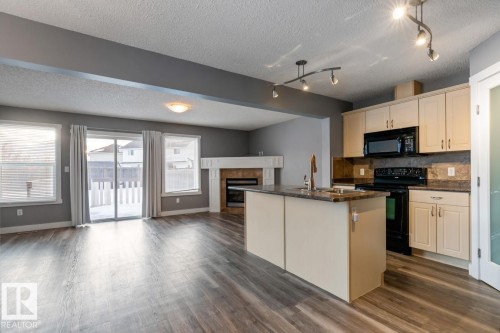 1119 37B Avenue, Edmonton, AB - Indoor Photo Showing Kitchen With Fireplace