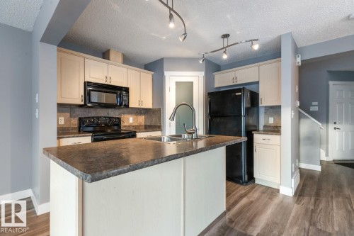 1119 37B Avenue, Edmonton, AB - Indoor Photo Showing Kitchen With Double Sink