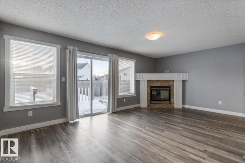 1119 37B Avenue, Edmonton, AB - Indoor Photo Showing Living Room With Fireplace