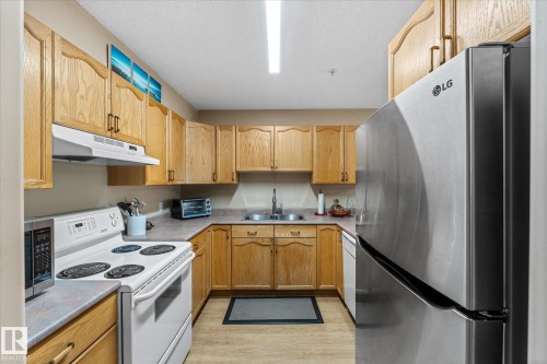 203 160 Kingswood Boulevard, St. Albert, AB - Indoor Photo Showing Kitchen With Double Sink