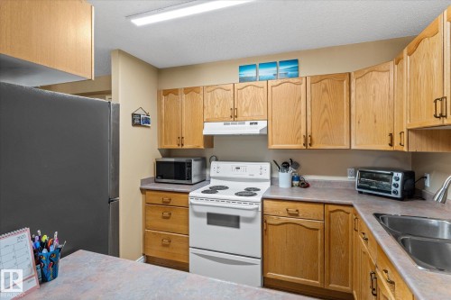 203 160 Kingswood Boulevard, St. Albert, AB - Indoor Photo Showing Kitchen With Double Sink