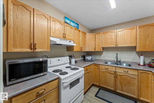 203 160 Kingswood Boulevard, St. Albert, AB - Indoor Photo Showing Kitchen With Double Sink