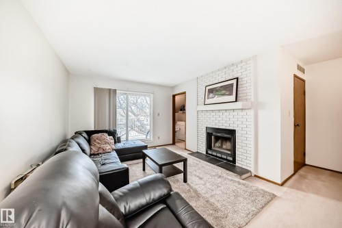 307 60 Alpine Place, St. Albert, AB - Indoor Photo Showing Living Room With Fireplace