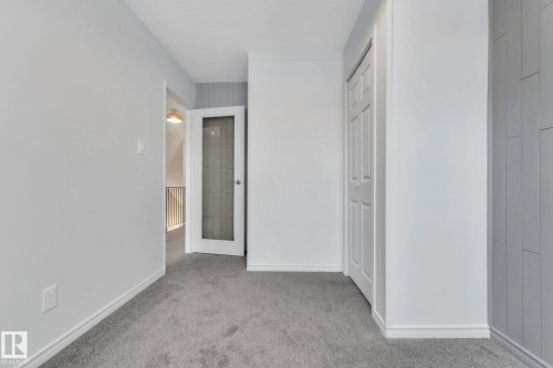Unfurnished bedroom with light colored carpet and baseboards - 1281 Hooke Road, Edmonton, AB - Indoor Photo Showing Other Room